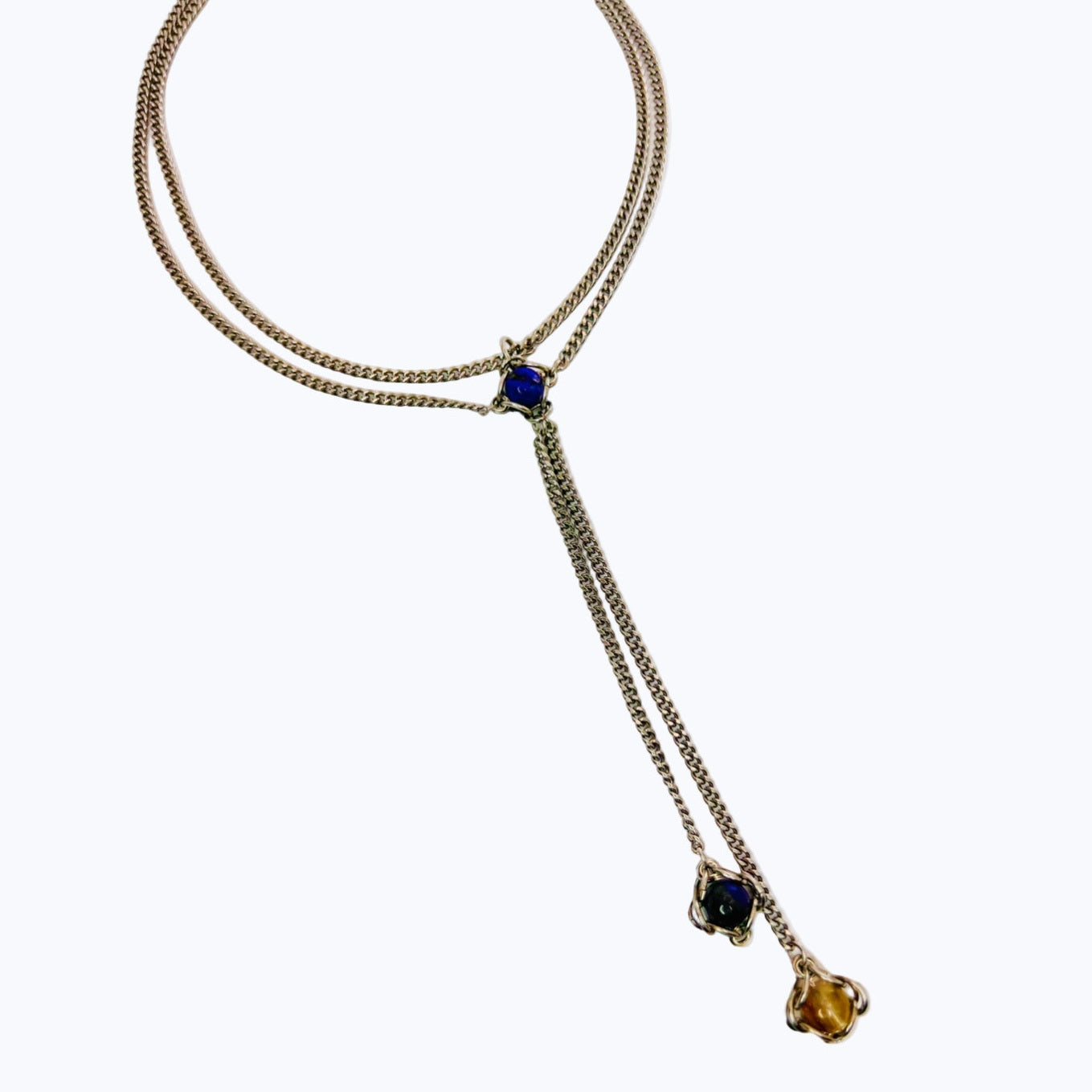 Necklace with gemstone pendants on a white background